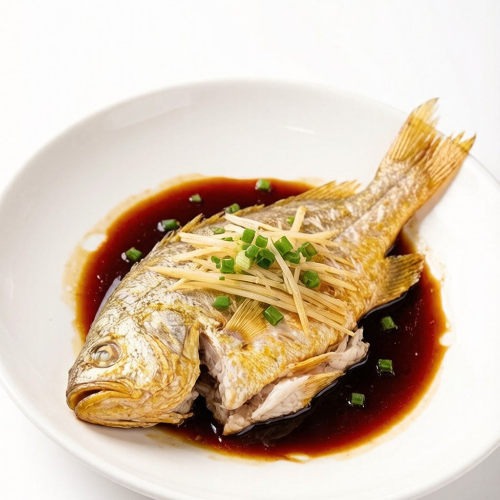 Pan-fried whole yellow croaker with spring onion garnish